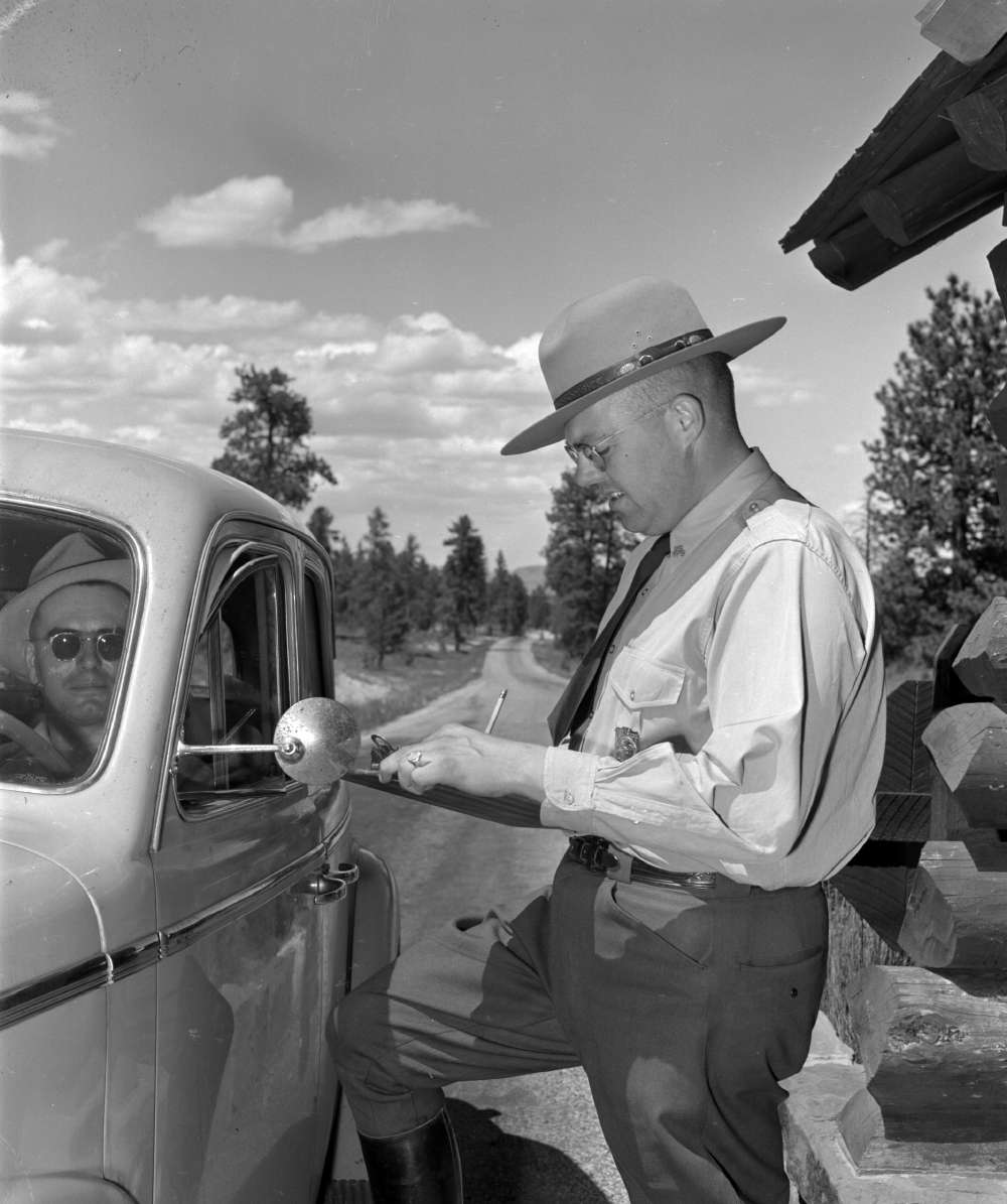      [A park ranger assists visitors at a Bryce Canyon National Park checkpoint, Union Pacific Museum Collection.]     A park ranger assists visitors at a Bryce Canyon National Park checkpoint